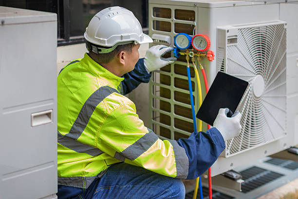 Professional Air Duct Cleaning technician working in Hoschton, GA